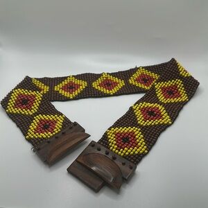 Anthropologie beaded brown and yellow stretchy belt with defect